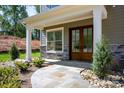 Elegant home entryway featuring stone accents and a stunning double-door entrance at 139 Poplar Grove Rd, Mooresville, NC 28117