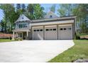 Charming home featuring a three-car garage and well-maintained lawn at 139 Poplar Grove Rd, Mooresville, NC 28117