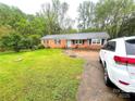 Charming single-story home with a well-manicured lawn and brick facade at 2116 Dana Pl, Shelby, NC 28152