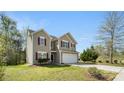 This two-story home features a two-car garage, neutral siding, and well-maintained landscaping at 2120 Turtle Point Rd, Charlotte, NC 28262