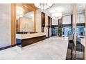 Spacious lobby with sleek marble floors, modern chandeliers, and a welcoming reception area at 222 S Caldwell St # 1510, Charlotte, NC 28202