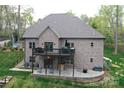 Backyard features a spacious deck and patio, perfect for outdoor entertaining and relaxation in a private setting at 2757 Trent Ne Dr, Conover, NC 28613