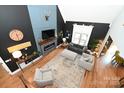 Bright, open living room with high ceilings and a modern fireplace, featuring stylish furnishings and ample natural light at 2757 Trent Ne Dr, Conover, NC 28613