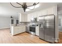 Modern kitchen featuring stainless steel appliances, granite countertops, and ample cabinet space at 3713 Capricorn Rd, Lancaster, SC 29720