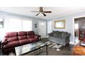 Inviting living room featuring comfortable seating, a decorative mirror and great natural light at 427 Spencer St, Rock Hill, SC 29730
