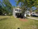 Charming two-story home with a well-manicured lawn, mature trees, and inviting curb appeal at 6846 Beverly Springs Dr, Charlotte, NC 28270