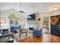 Bright living room with a modern fireplace, vaulted ceilings, and stylish furnishings at 7444 Hurstbourne Green Dr, Charlotte, NC 28277