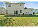 The back exterior showcases a well-maintained yard and patio area, perfect for outdoor entertaining and relaxation at 8719 Sweet Sage Ln, Charlotte, NC 28227
