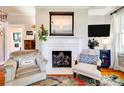 Cozy living room with fireplace, hardwood floors, and natural light at 902 Hawthorne Rd, Shelby, NC 28150