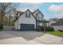 Traditional two-story home with an attached two-car garage and a welcoming front porch at 908 Carole Summey Dr, Dallas, NC 28034