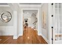 Welcoming foyer with hardwood floors, elegant trim, and neutral color palette at 9927 Clarkes View Nw Pl, Concord, NC 28027