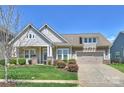 Beautiful single-Gathering home with an attached garage, front yard landscaping and a covered front porch at 10378 Ambercrest Nw Ct, Huntersville, NC 28078