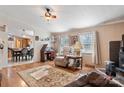 Comfortable living room featuring hardwood floors and a smooth transition into the dining area at 119 Loray Ln, Statesville, NC 28625