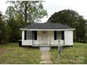 Charming single-story home with a welcoming front yard and black shutters at 1230 Roberts St, China Grove, NC 28023