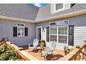 Inviting back deck featuring comfortable seating, perfect for outdoor relaxation and enjoying the view at 126 Top Flite Dr, Statesville, NC 28677