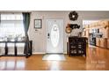 Inviting foyer with hardwood floors, decorative accents, and natural light, leading to an open living space at 126 Top Flite Dr, Statesville, NC 28677