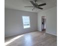 Bright living room with new flooring, ceiling fan, and natural light at 132 Loomis St, Chester, SC 29706