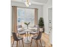 Cozy breakfast nook with a round table, seating for four, and lots of natural light at 1409 Rheo Nw Ct, Concord, NC 28027