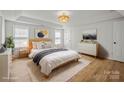 Bright main bedroom with natural light and neutral decor, creating a relaxing retreat at 1409 Rheo Nw Ct, Concord, NC 28027