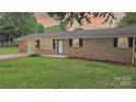 Cozy brick home with bright white door and well-kept lawn at sunset at 1500 19Th Avenue Ne Pl, Hickory, NC 28601