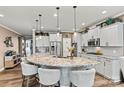 Spacious kitchen features an oversized island with granite countertops and stainless steel appliances at 152 Blossom Ridge Dr, Mooresville, NC 28117