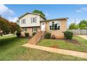 Charming two-story home with brick and vinyl siding, complemented by a well-manicured lawn and landscaped yard at 1766 Colony Rd, Rock Hill, SC 29730