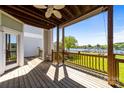 Spacious balcony with wood flooring and railings offers stunning lake views at 18700 Nautical Dr # 203, Cornelius, NC 28031