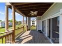 Inviting outdoor patio featuring stylish wicker furniture and a ceiling fan for relaxing and enjoying the views at 18700 Nautical Dr # 203, Cornelius, NC 28031