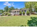 Charming home with well-kept lawn and mature trees at 2614 Thornton Rd, Charlotte, NC 28208