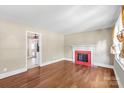 Inviting living room features beautiful hardwood floors and a classic fireplace at 2721 Albany Ln, Charlotte, NC 28205
