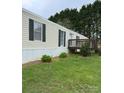 Attractive exterior showing a quaint home with an inviting entrance and green lawn at 5767 Swinging Bridge Rd, Conover, NC 28613