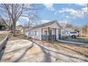 Charming cottage-style home with a well-manicured lawn and inviting front porch at 705 Sumter St, Lancaster, SC 29720