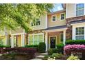 Charming townhome with stone accents, manicured landscaping, and a welcoming front entrance at 8504 Sunset Hill Rd, Waxhaw, NC 28173
