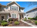 Inviting home exterior showcasing manicured landscaping and a stone facade at 8524 Sunset Hill Rd, Waxhaw, NC 28173