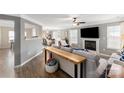 Spacious living room with an open floor plan and fireplace seamlessly connects to the dining area at 8604 Cedardale Ridge Ct, Charlotte, NC 28269