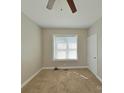 Bright bedroom with a window and ceiling fan, providing a comfortable and relaxing space at 932 3Rd Street Sw Pl, Hickory, NC 28602