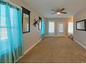 Inviting living room with neutral tones, ceiling fan, and natural light, ideal for entertaining guests at 932 3Rd Street Sw Pl, Hickory, NC 28602