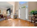 Welcoming foyer with hardwood floors, a two-story window and grand entrance at 10609 Oak Pond Cir, Charlotte, NC 28277