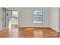 Sun-filled living room with hardwood floors and neutral paint at 165 Northwest Rd, Hickory, NC 28601