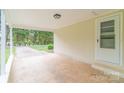 Covered carport area with ample space and access to an exterior door at 212 Pine St, Rockwell, NC 28138