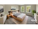 A bright and virtually staged bedroom with large windows and ample natural light at 2163 Woodstream Rd, Harrisburg, NC 28075