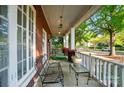 Charming front porch with seating area, perfect for enjoying a relaxing time outdoors at 247 W Park Ave, Charlotte, NC 28203