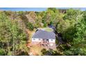 Aerial rear view of home featuring a large deck, patio, and fenced yard at 3232 47Th Avenue Ne Pl, Hickory, NC 28601