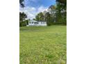 A charming single-story home with front porch surrounded by lush green grass at 3514 Valley Dr, Chester, SC 29706