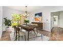 Elegant dining room featuring modern decor and a view of the landscaped yard at 426 Saint Michaels Way, Fort Mill, SC 29708