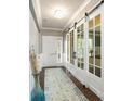 Inviting hallway with wood floors, sliding glass doors, and neutral decor with a decorative vase at 487 Hawks Creek Pkwy, Fort Mill, SC 29708