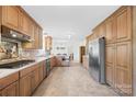 Large kitchen with granite countertops, stainless appliances, and tile flooring at 4896 Pageland Hwy, Lancaster, SC 29720