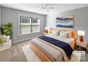 Comfortable main bedroom featuring large window, plush carpet, and neutral color scheme at 5104 Shannamara Dr, Matthews, NC 28104