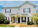 Charming townhouse with inviting entrance and manicured landscaping at 9615 Littleleaf Dr, Charlotte, NC 28215
