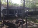The property includes a screened porch, fire pit, and additional shade for outdoor enjoyment at 108 Captains Ct # B116, Mount Gilead, NC 27306